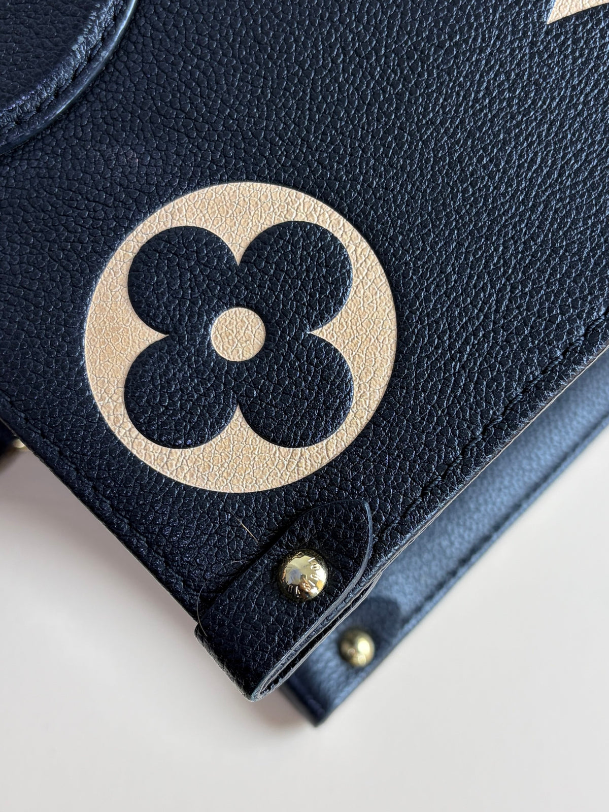 Louis Vuitton black/beige Monogram giant empriente on the go mm bag