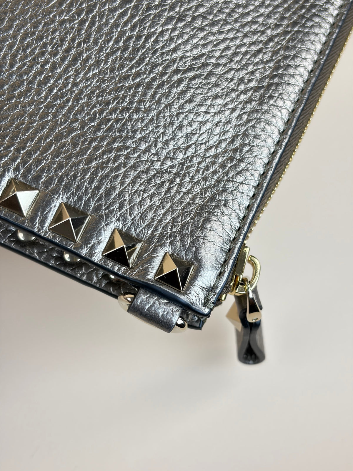 Valentino metallic gold pebbled calfskin rock stud medium zip pouch
