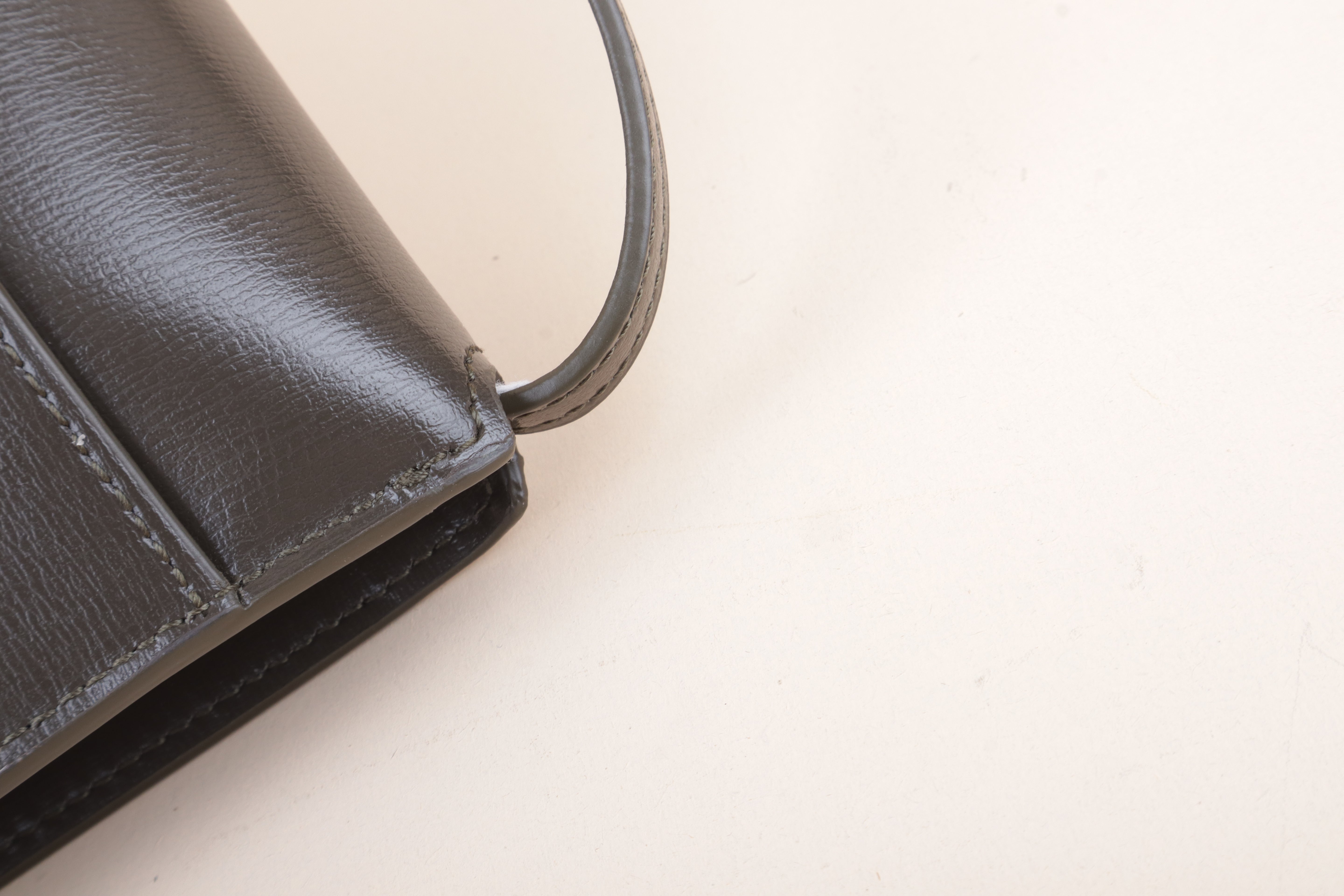 YSL Cassandre phone holder light musk