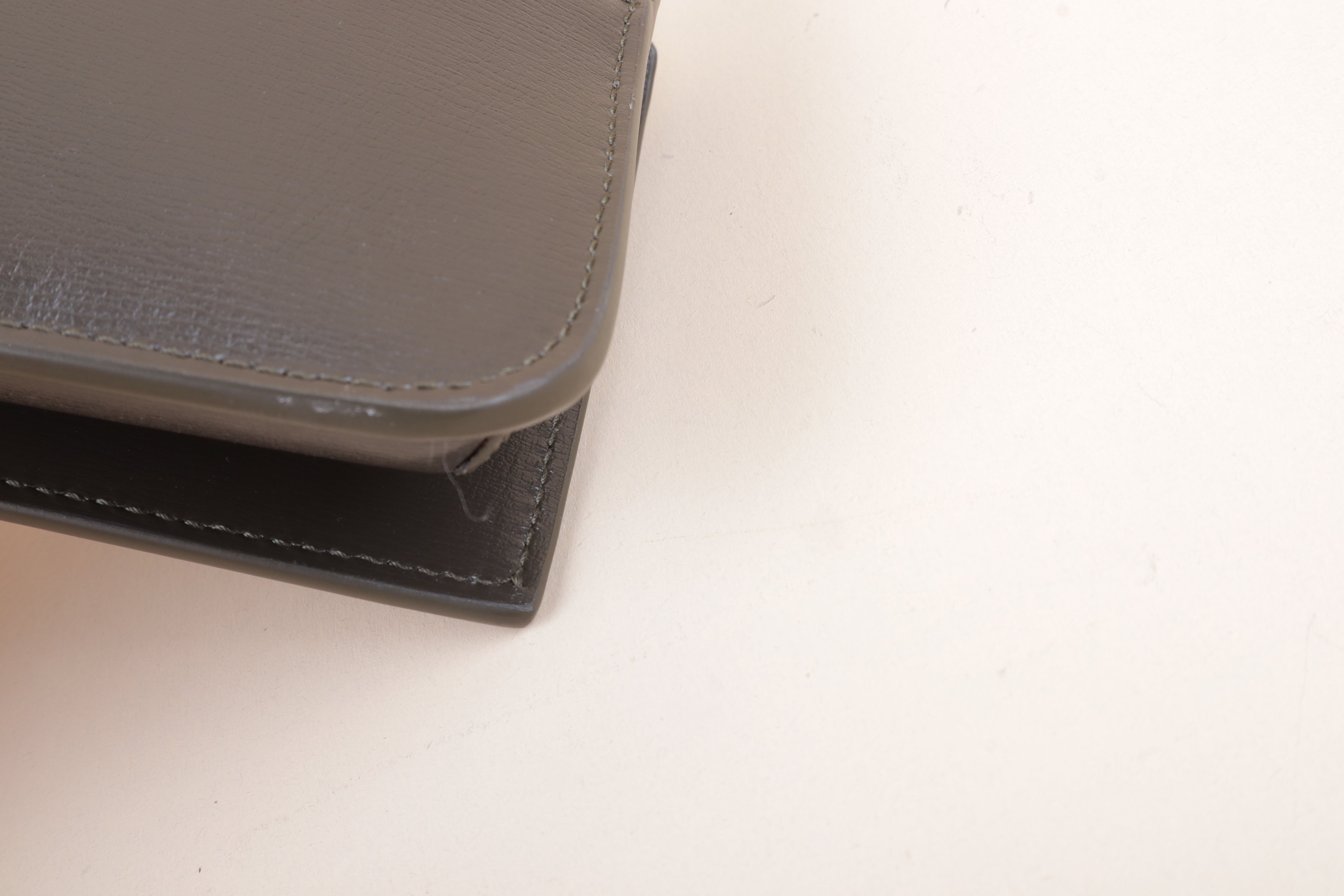 YSL Cassandre phone holder light musk